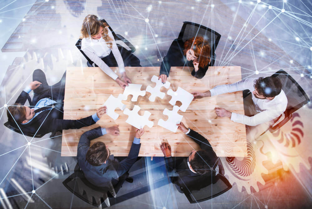 24 teamwork of partners concept of integration and startup with puzzle pieces and gear overlay double exposure with network effects